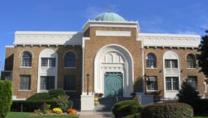 Morristown Jewish Center Beit Yirael building facade on a clear day with a bright blue sky.